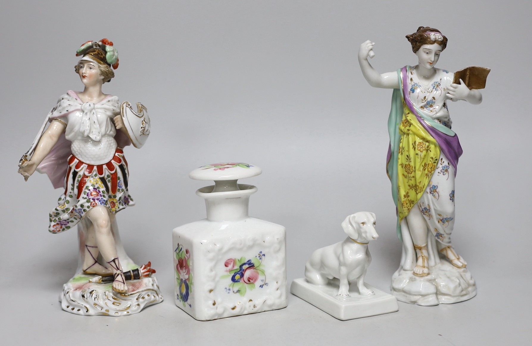 Two German porcelain figures, tallest 31cms high, a Fraureuth model of a dachshund and a Paris scent bottle